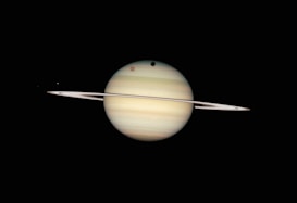 saturn and its rings in the dark sky