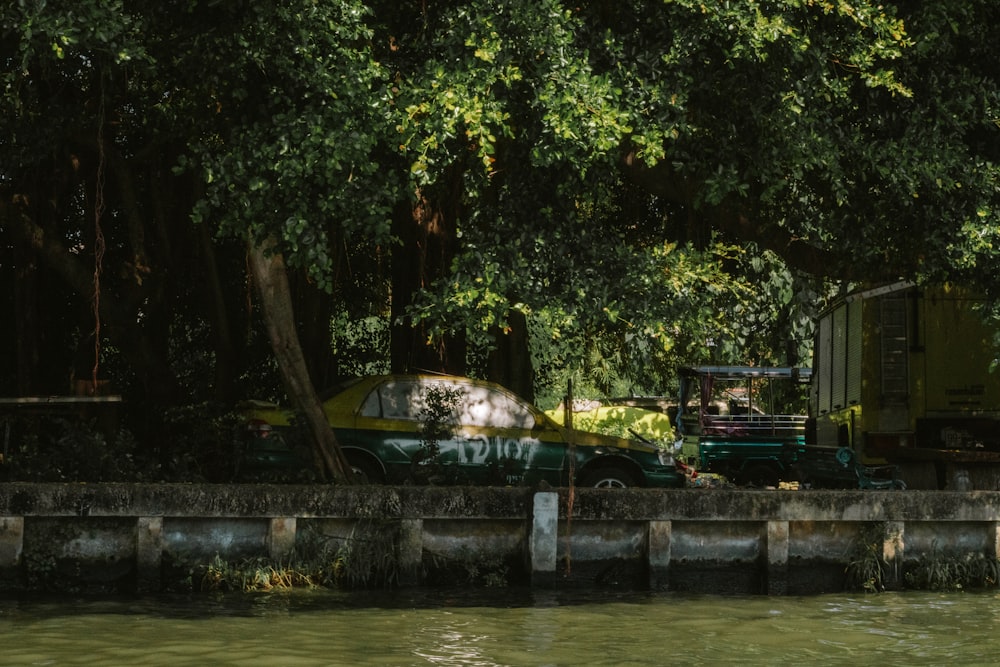 a truck parked on the side of a river