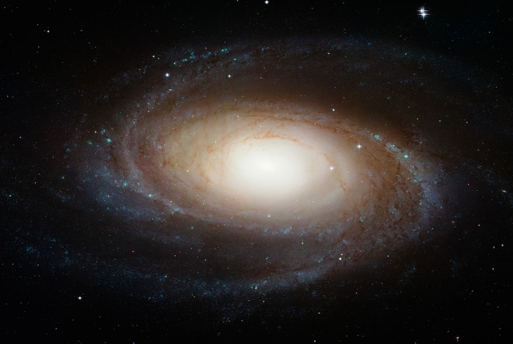 a spiral galaxy with stars in the background