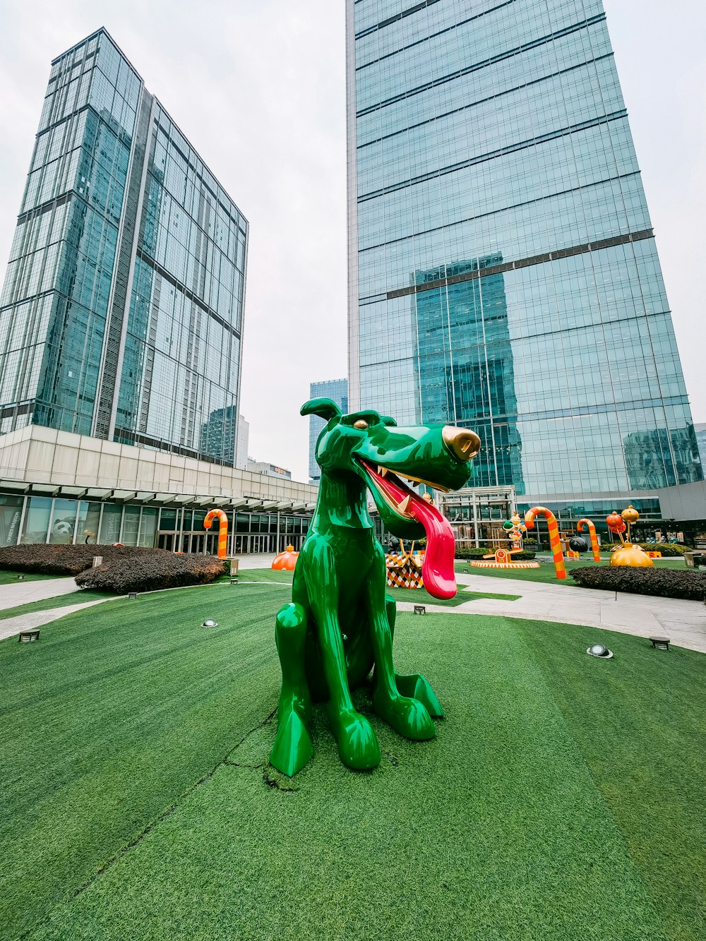 a statue of a dog with a frisbee in its mouth