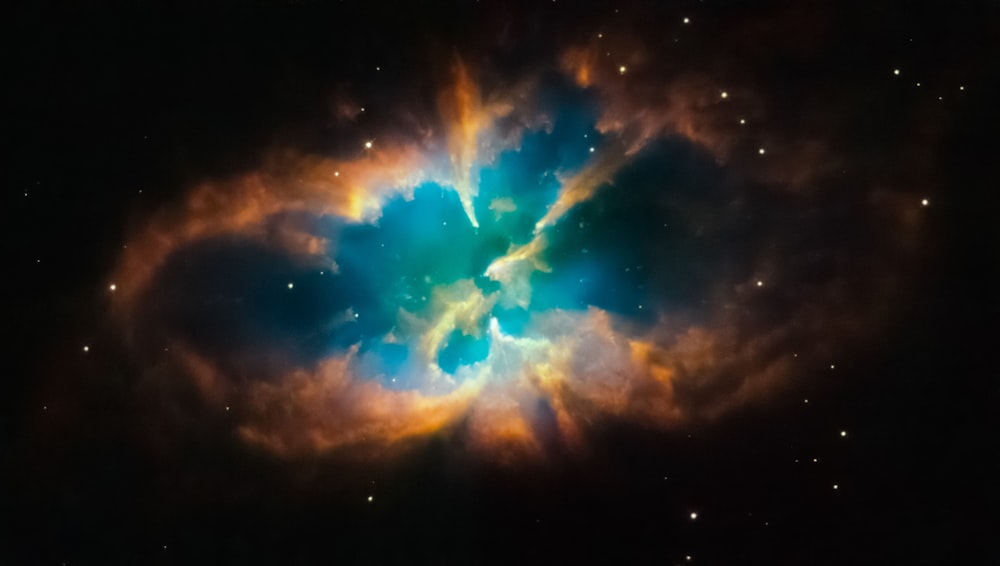 a colorful star in the middle of a black sky