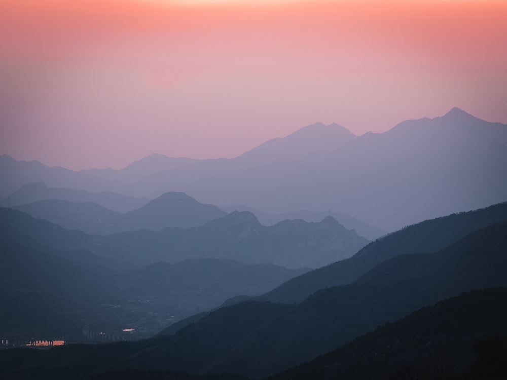 a view of a mountain range at sunset