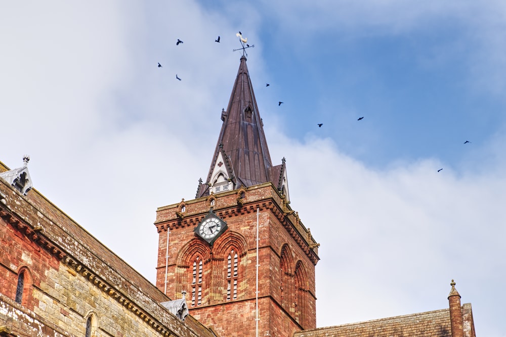 a church steeple with a clock on it