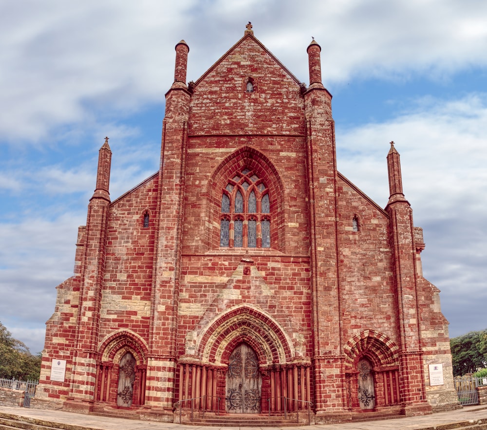 a large brick church with a clock tower