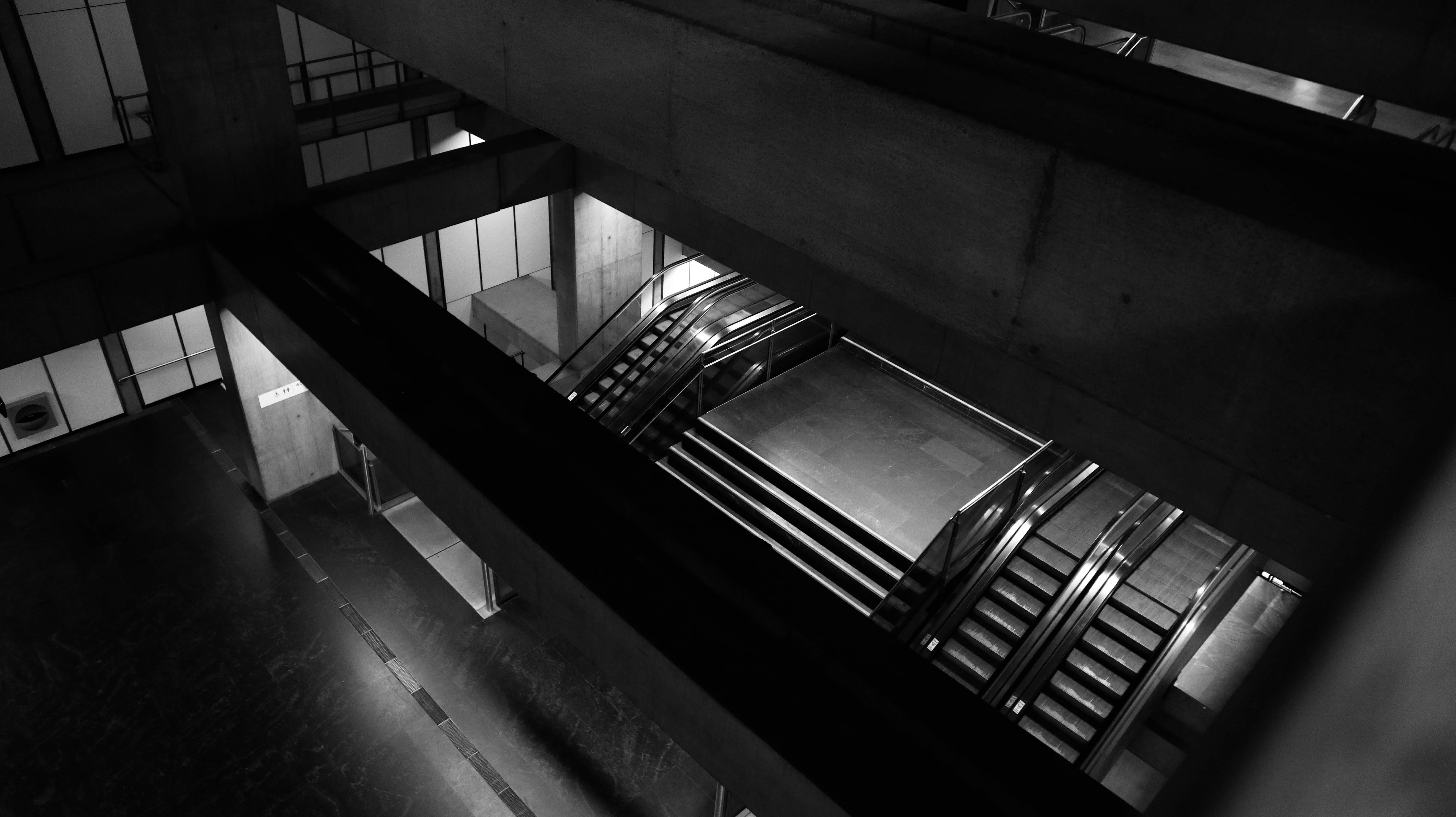 a black and white photo of a staircase in a building
