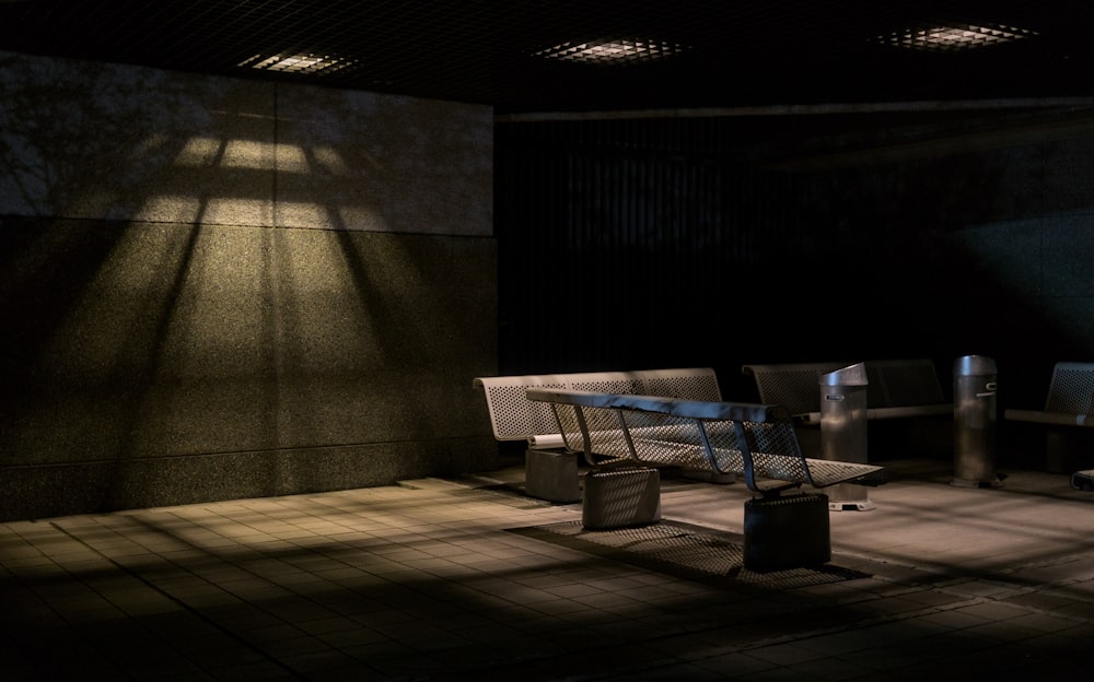 a bench sitting in the middle of a room