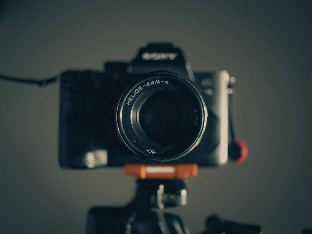 a camera sitting on top of a tripod