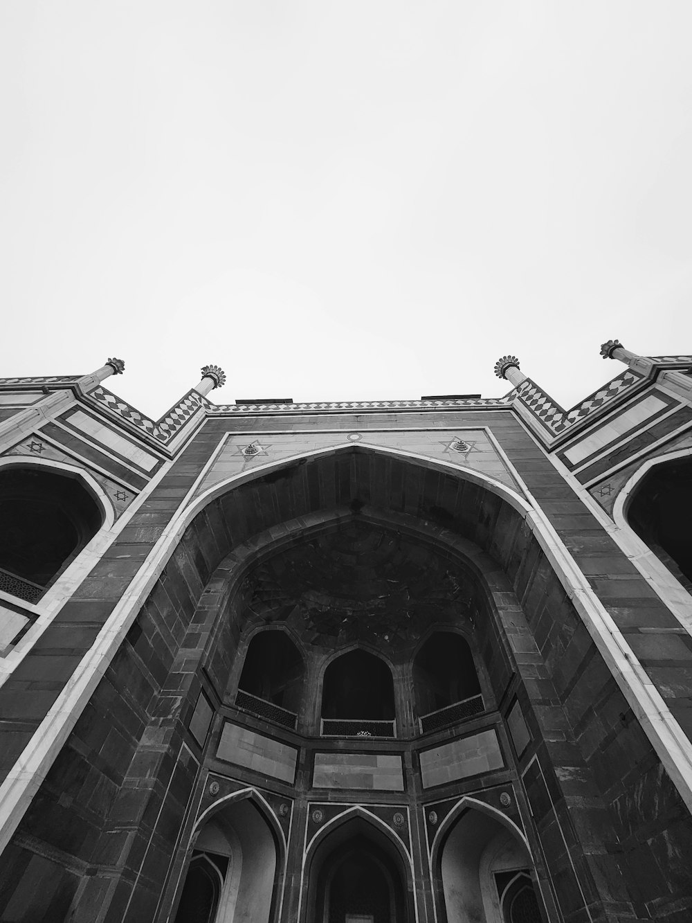 a black and white photo of a tall building