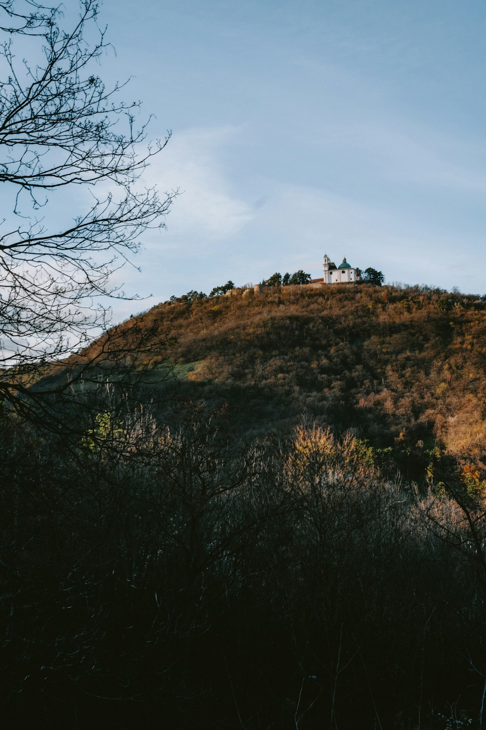 a hill with a house on top of it