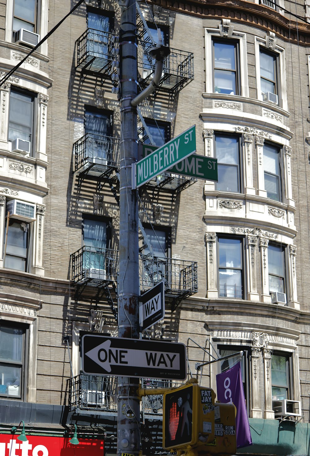 a street sign on a pole in front of a building