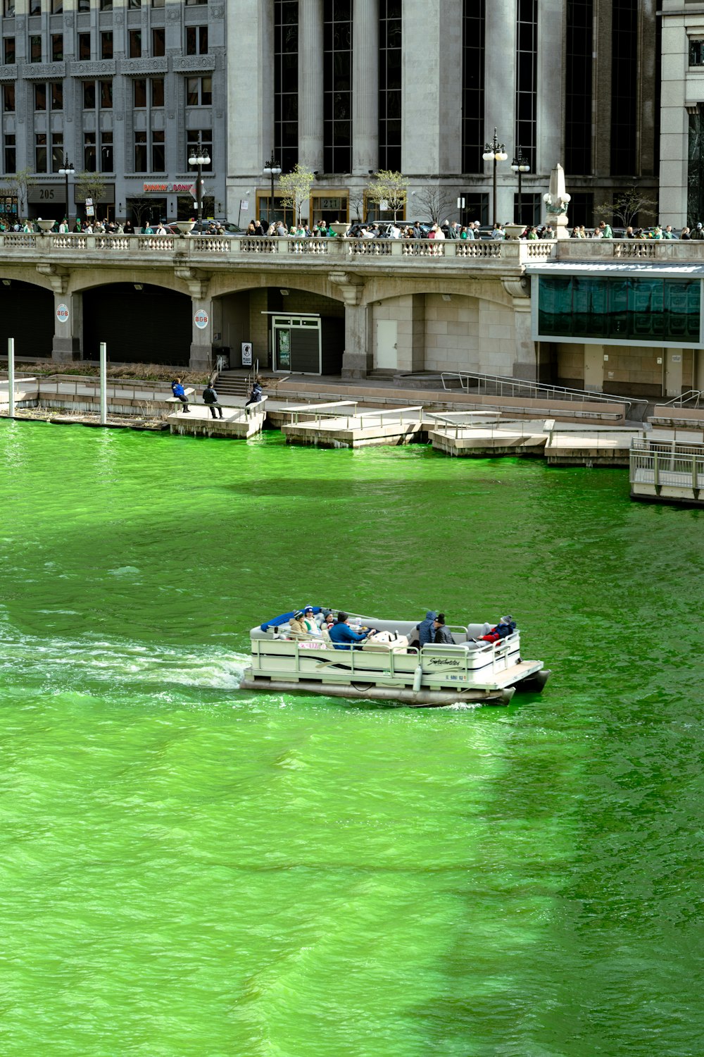 a boat in a body of green water