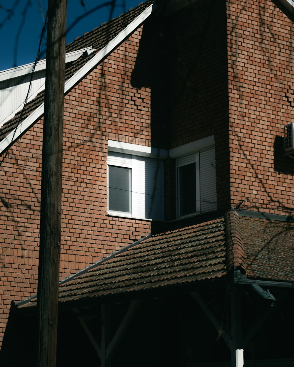 a red brick building with a clock on the front of it