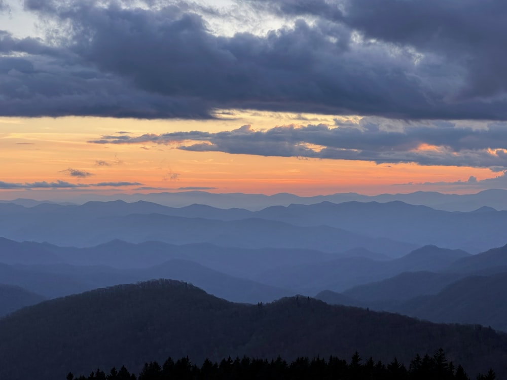 a view of a mountain range at sunset