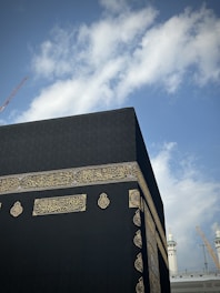 a large black building with a sky background