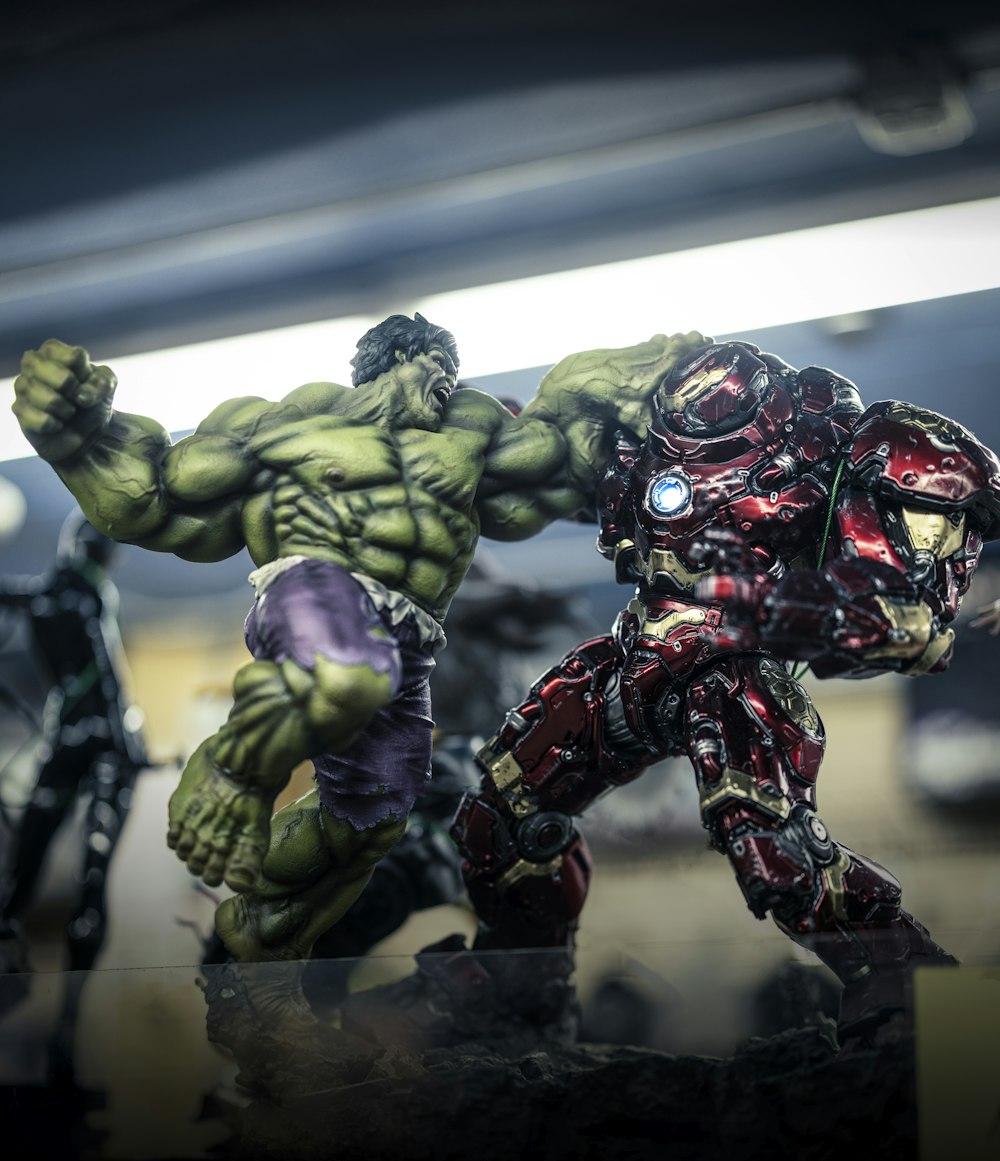 a hulk - man and a hulk - man action figure on a table