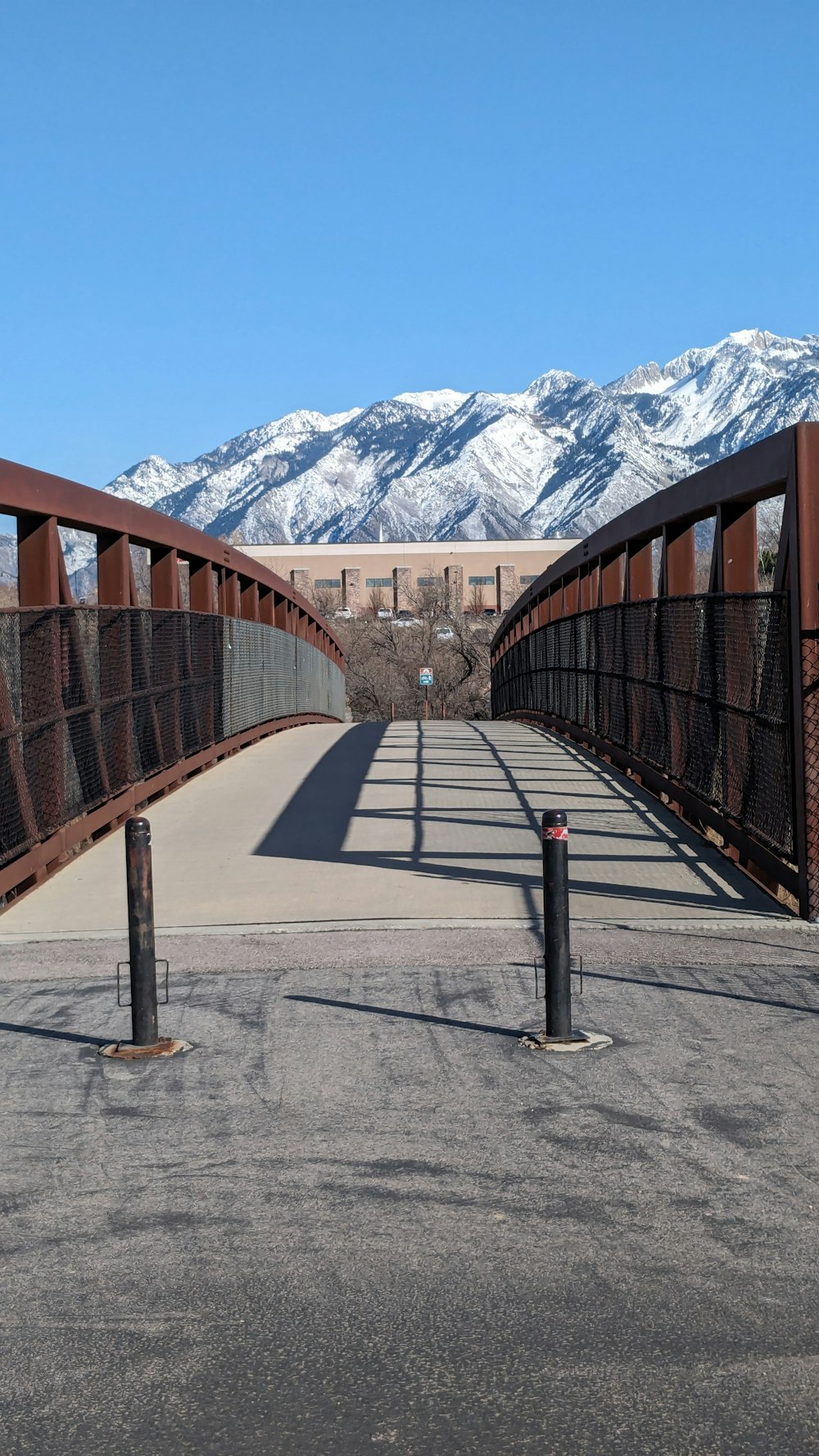 a bridge with mountains in the background