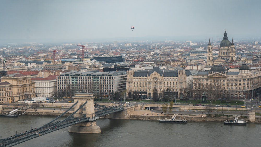 a view of a city with a bridge in the foreground