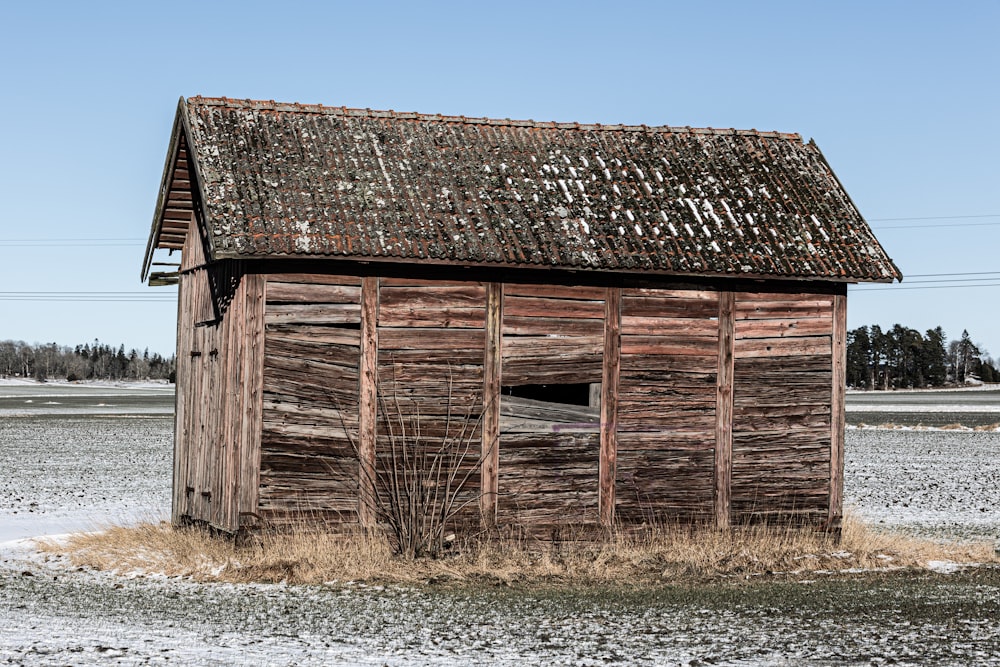 an old wooden building with a rusty roof