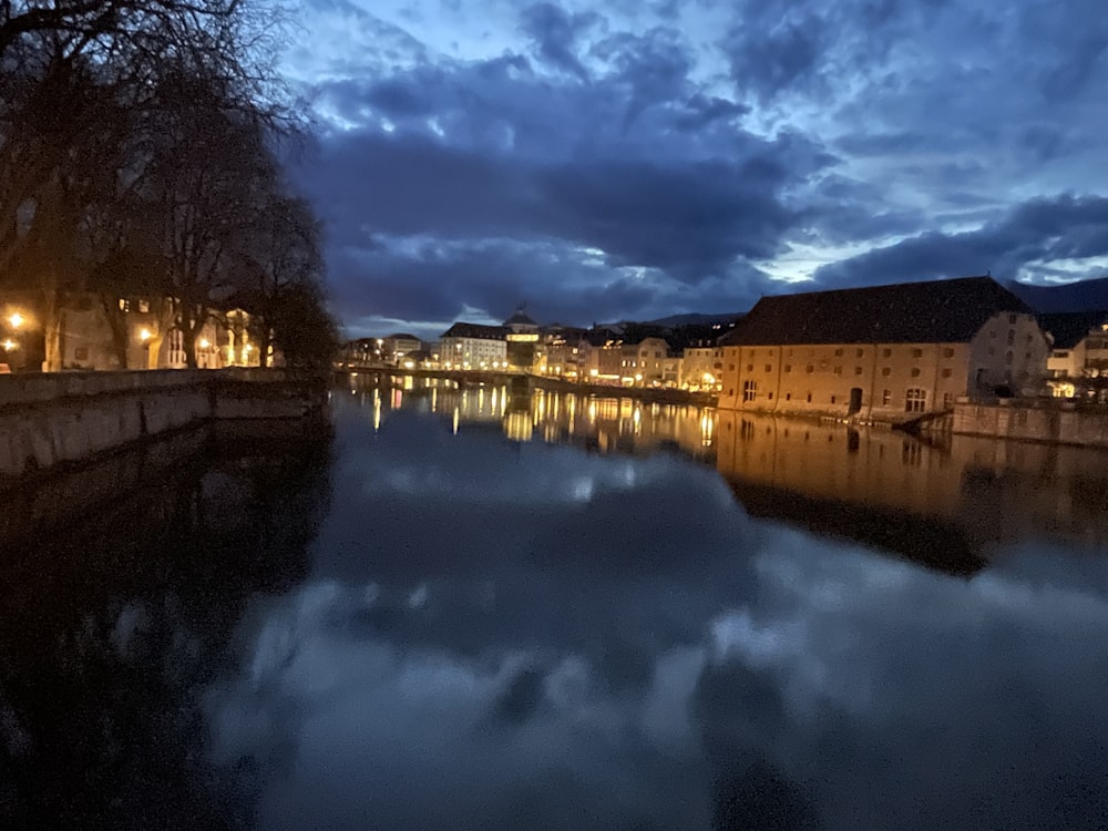 a body of water surrounded by buildings and trees