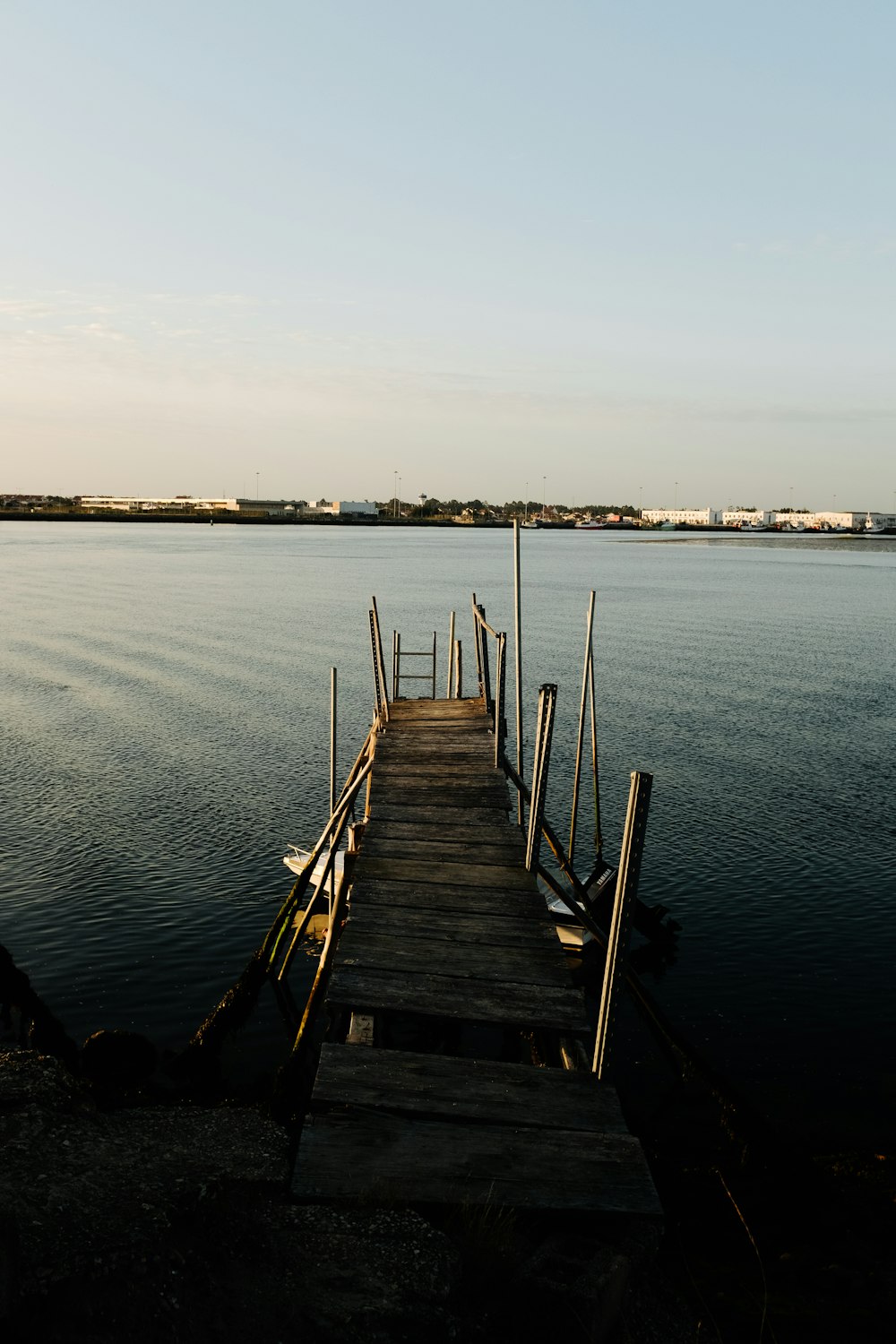 a wooden dock sitting on top of a body of water