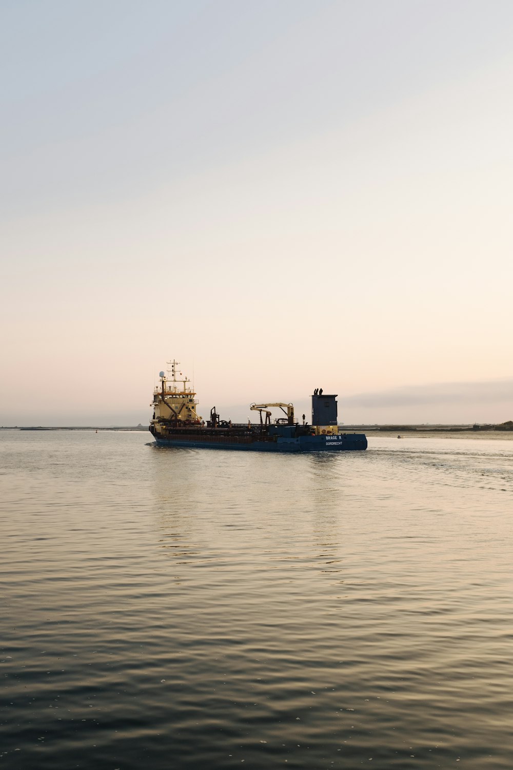 a large boat floating on top of a large body of water