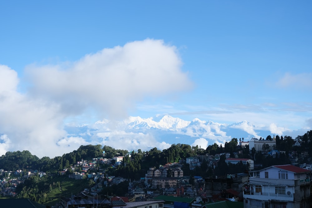 a view of a city with mountains in the background