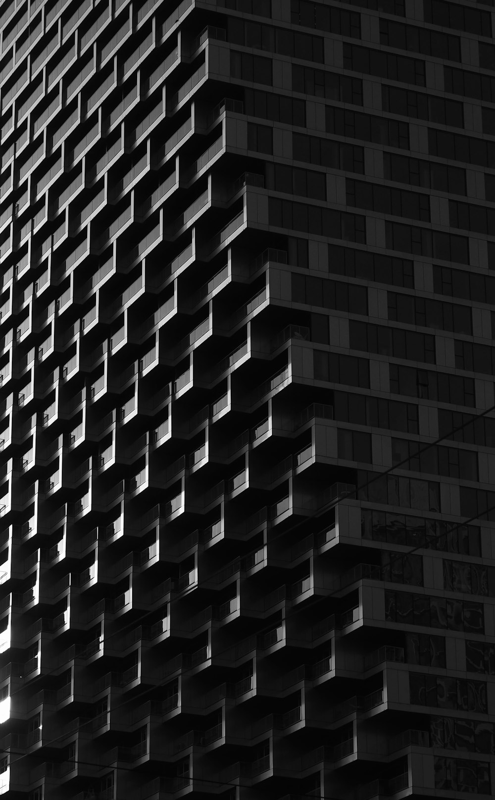 a black and white photo of a tall building