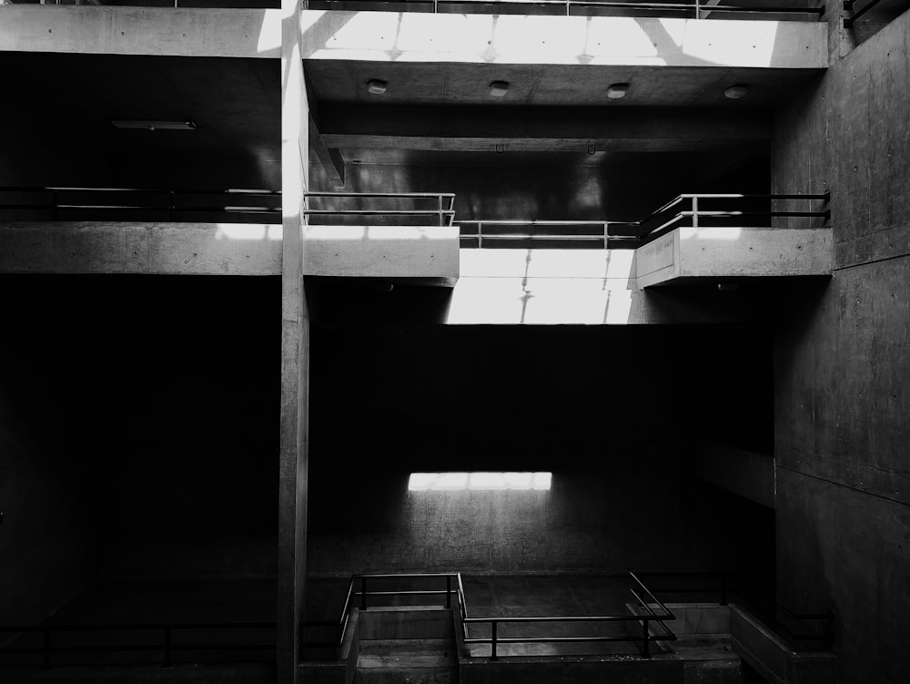 a black and white photo of a stairwell in a building