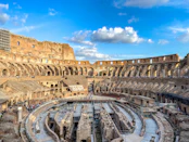the interior of a roman colossion with a blue sky in the background