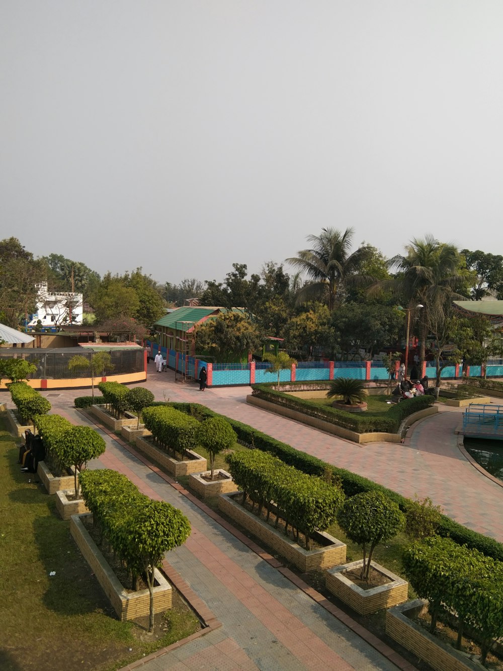 a view of a park with a pool in the middle of it