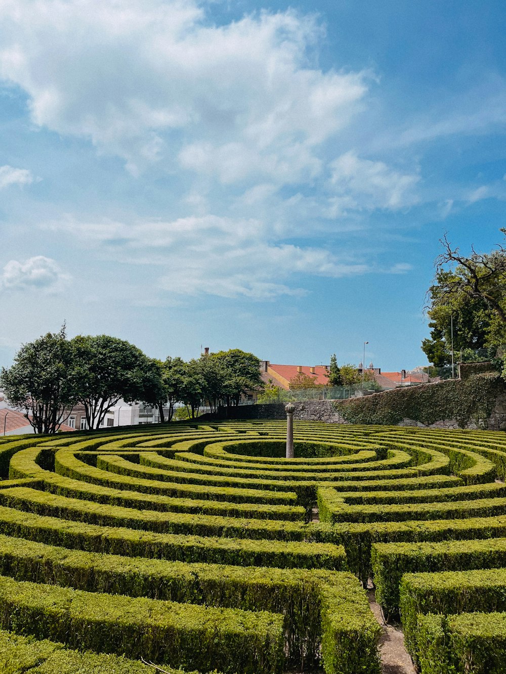 a large circular maze in the middle of a park