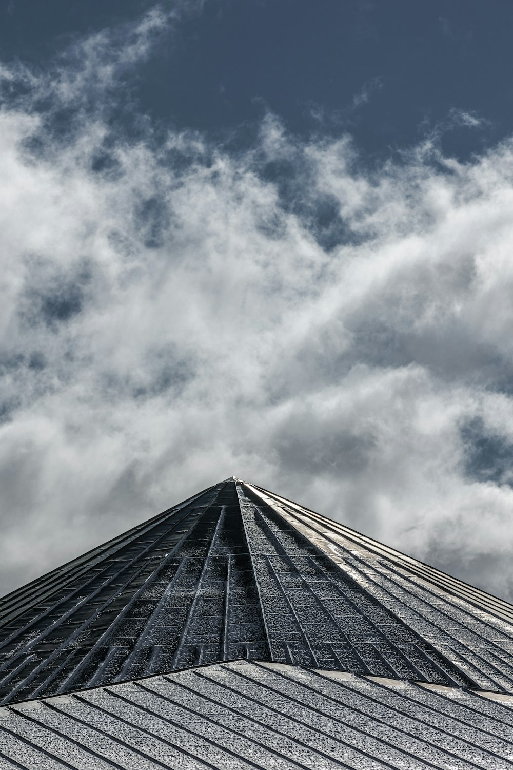 a very tall building with a sky background