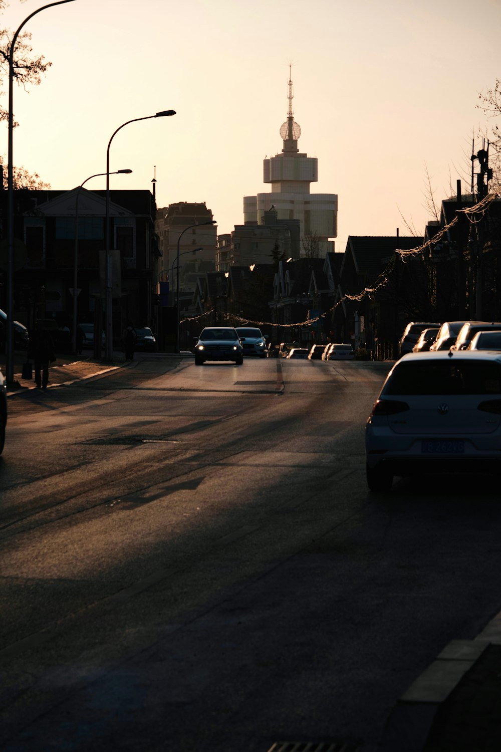 a city street with cars parked on the side of it