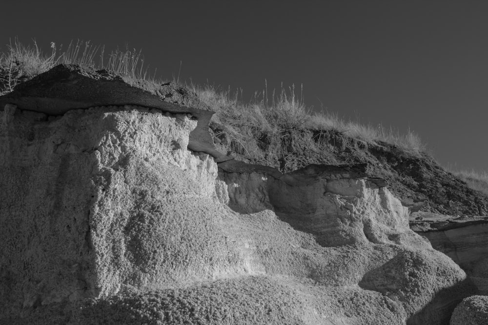 a black and white photo of a cliff