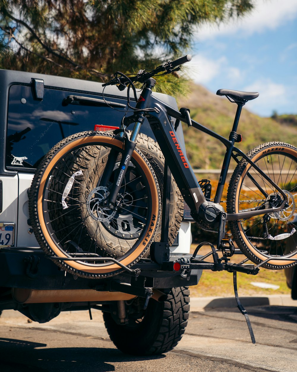 a bike is strapped to the back of a truck