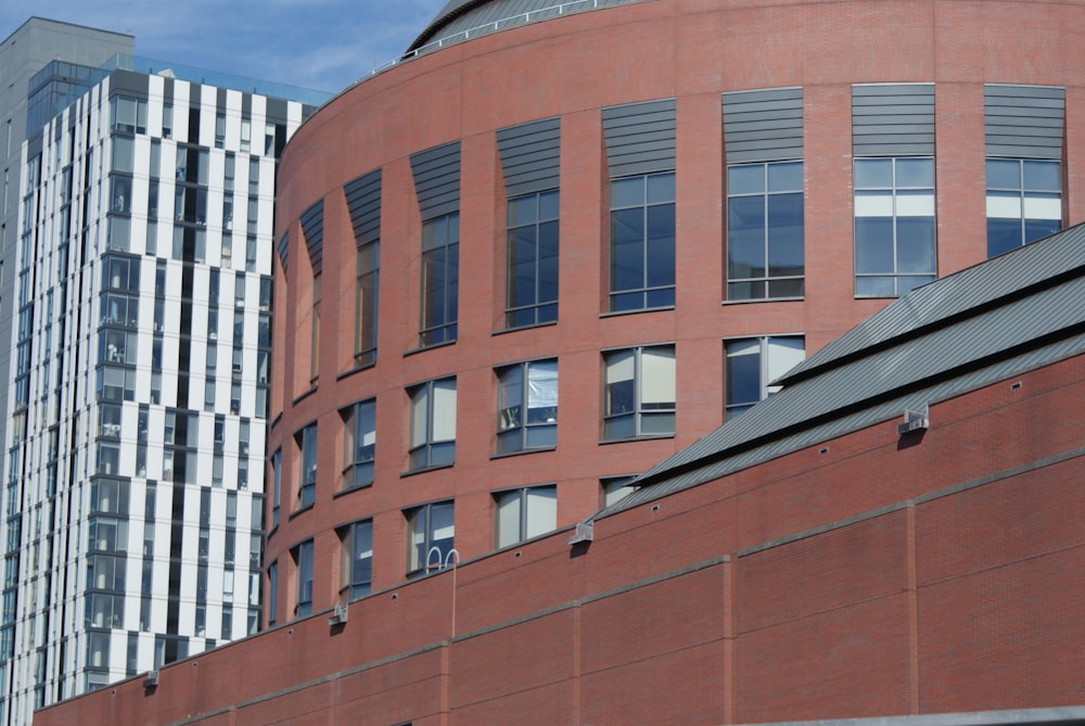 a red brick building with a clock on the front of it