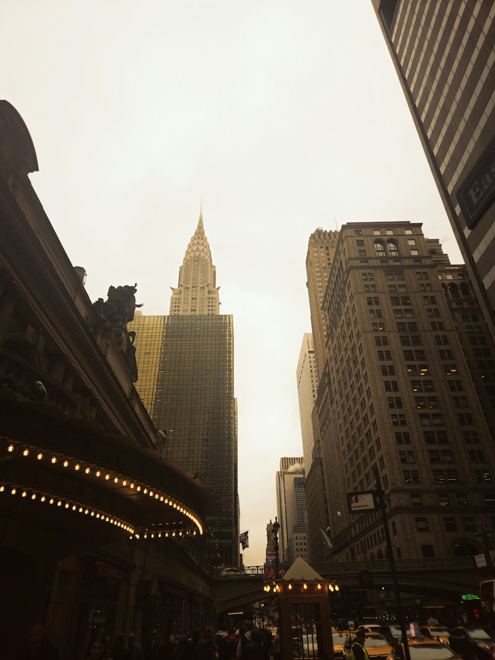 a very tall building towering over a city