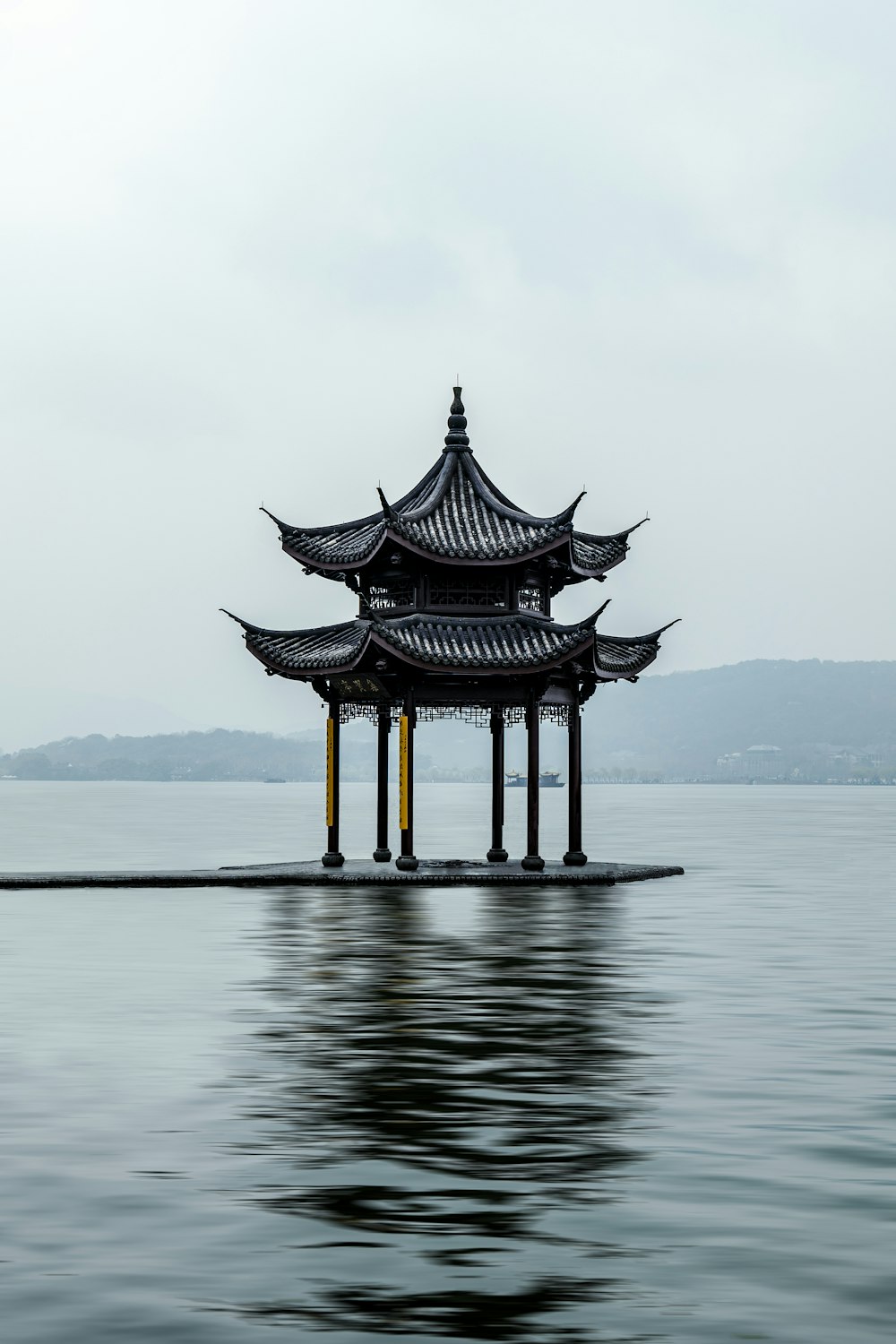 a building sitting on top of a body of water