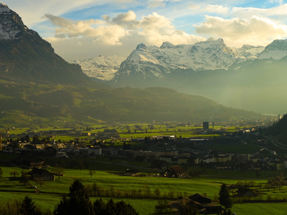 a view of a valley with mountains in the background