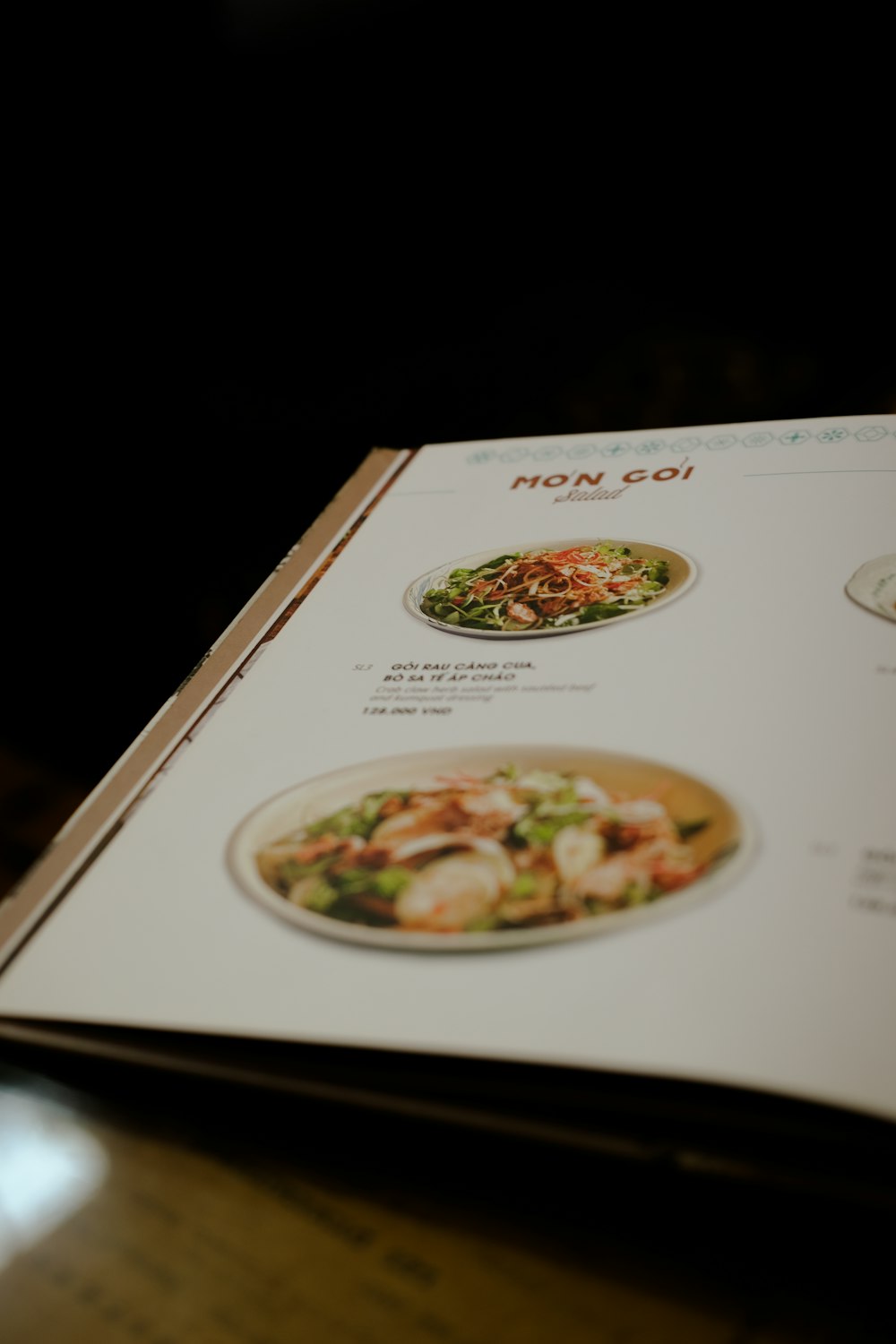 a menu is open on a wooden table