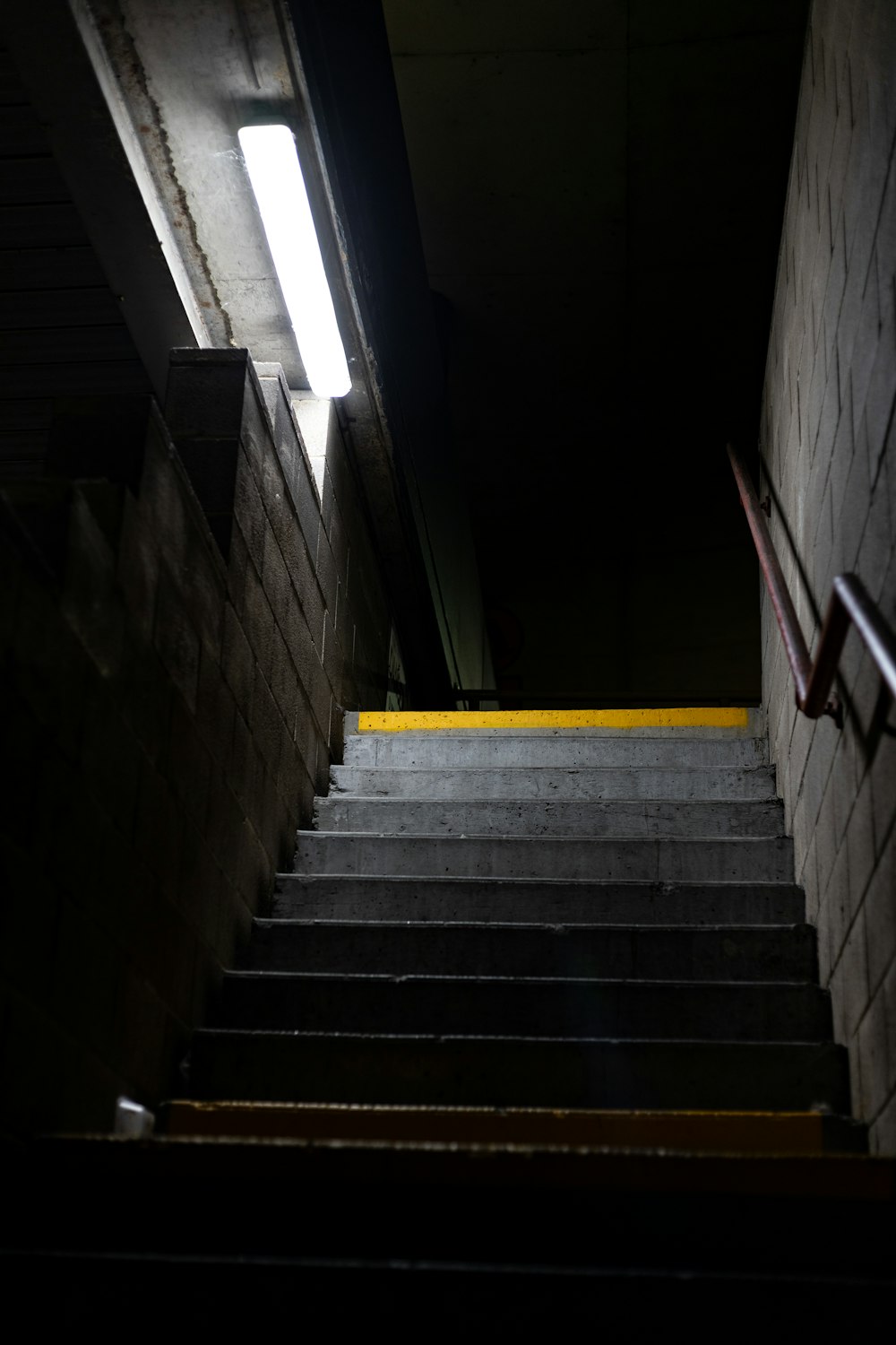 a set of stairs leading up to a light
