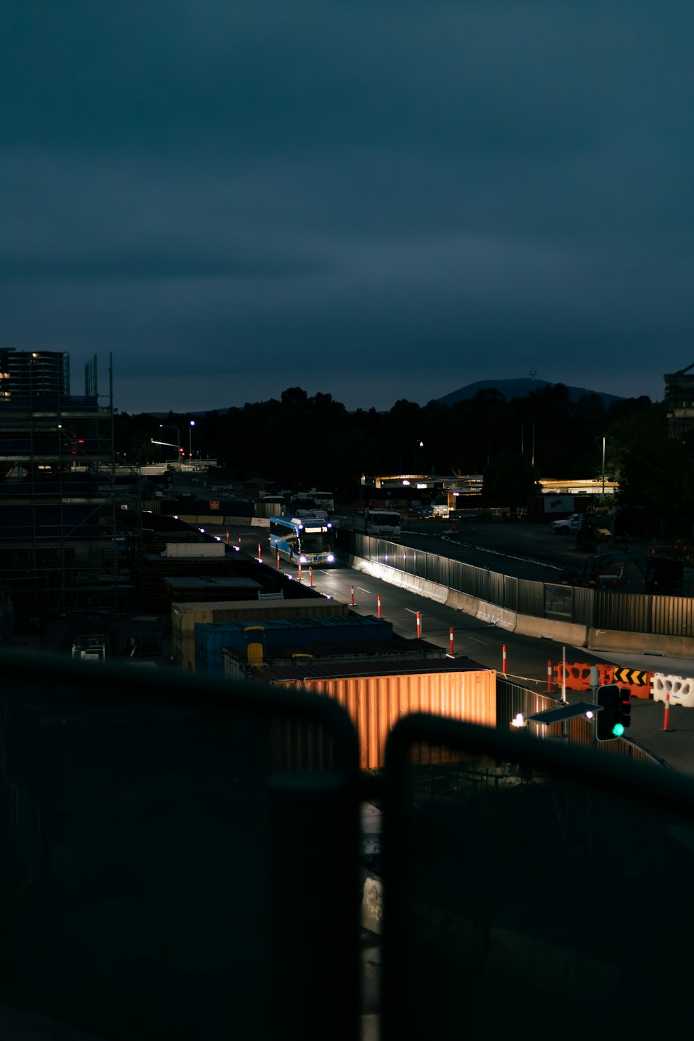 a view of a city at night from a bridge