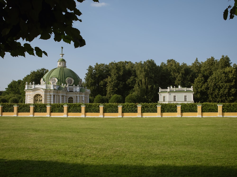 a large building with a green dome on top of it