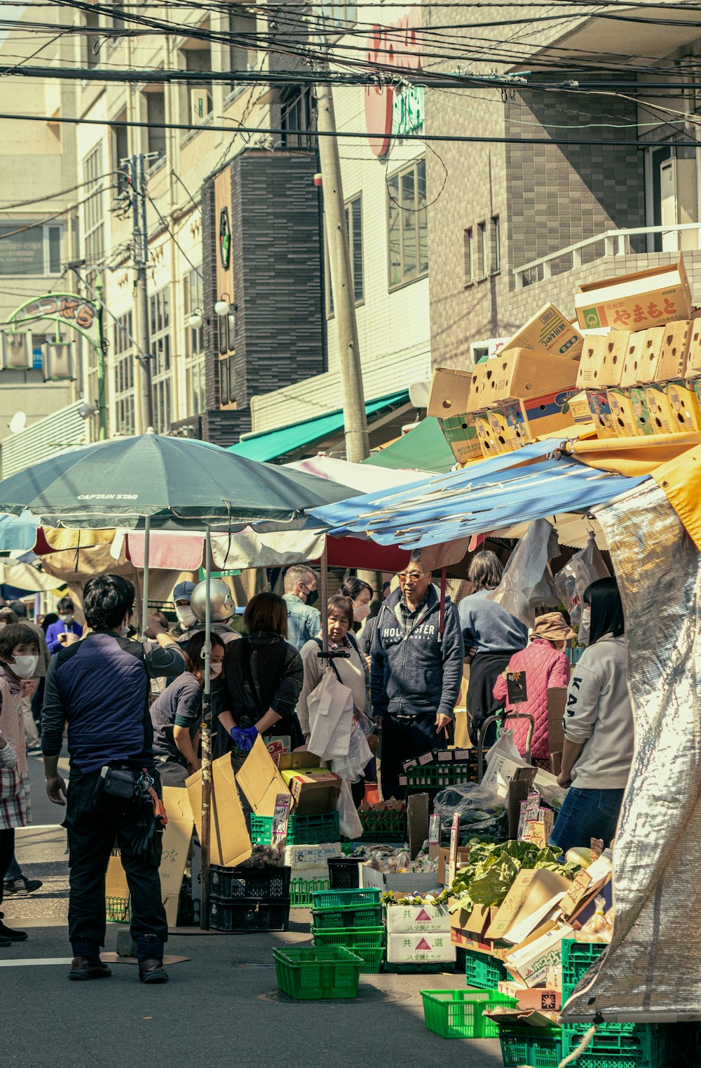 a group of people standing around a market