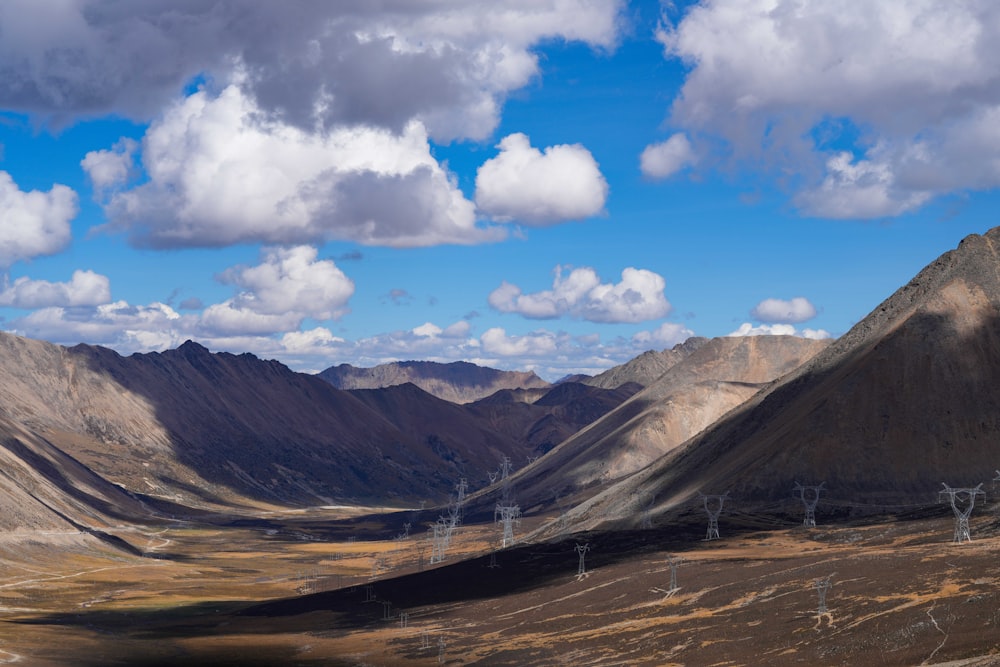 a view of a valley with mountains in the background