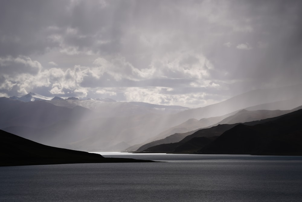 a large body of water surrounded by mountains