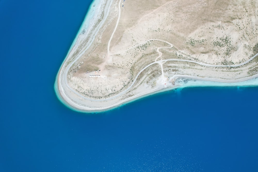 an aerial view of an island in the middle of the ocean