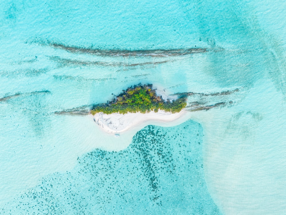 an aerial view of an island in the middle of the ocean