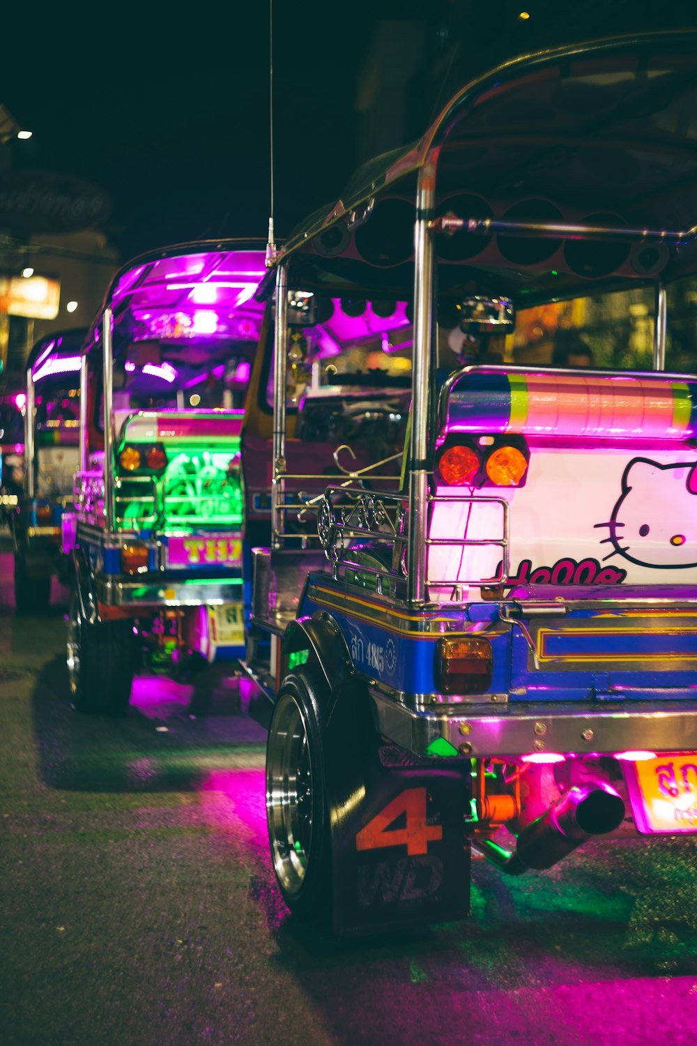 a couple of buses that are sitting in the street