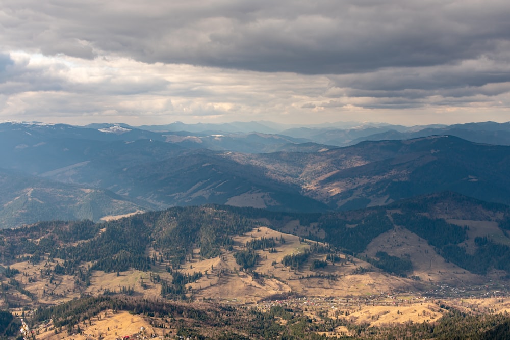 a view of a mountain range with a cloudy sky